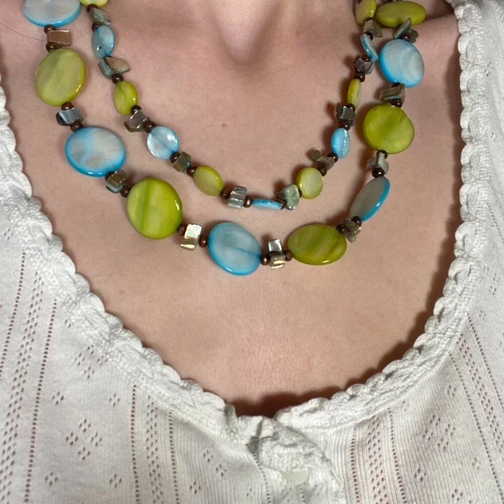 Vintage layered beaded necklace in shades of blue, green, and earthy brown