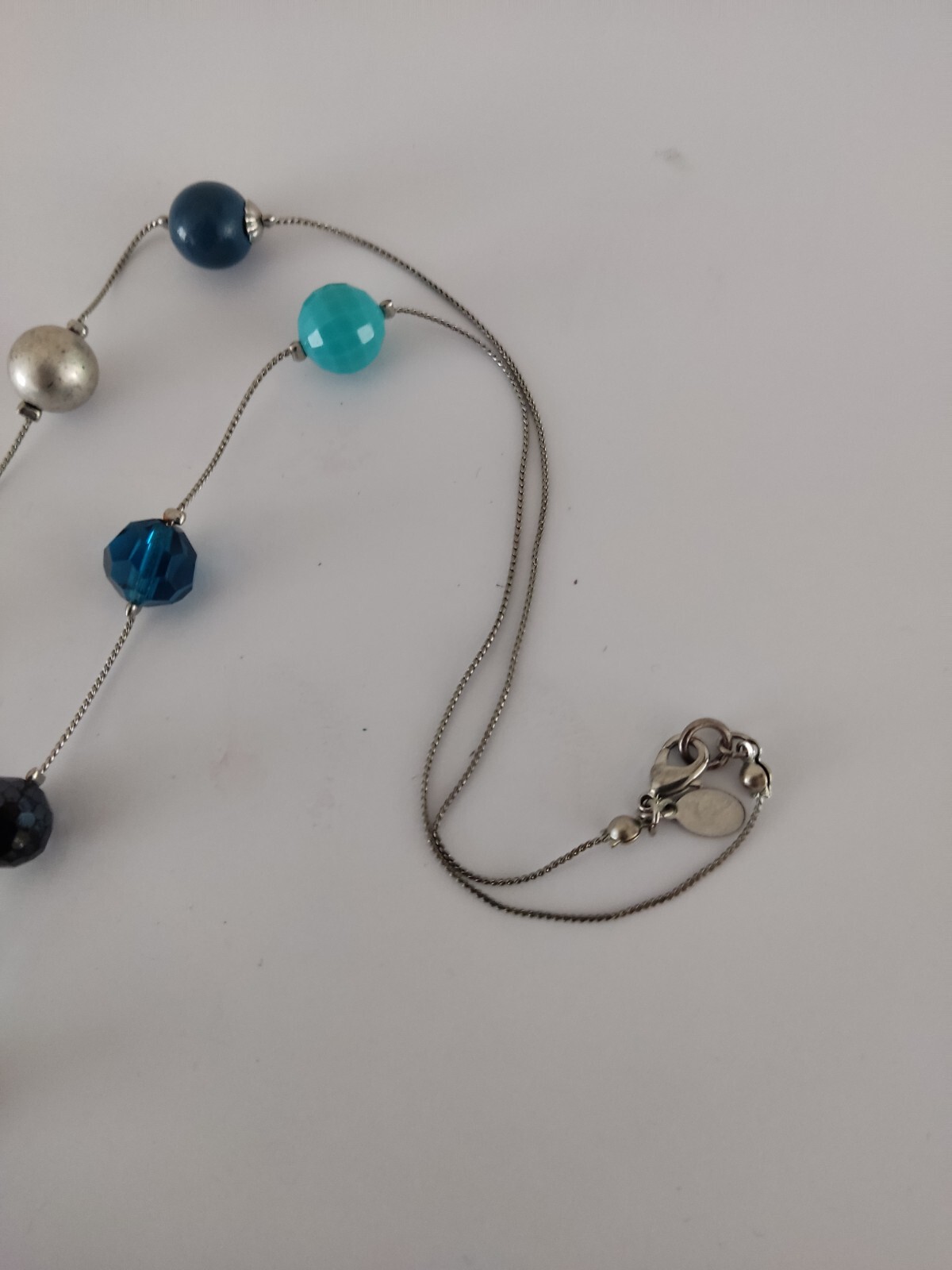 Accessorize long mixed bead blue Turquoise Navy necklace.