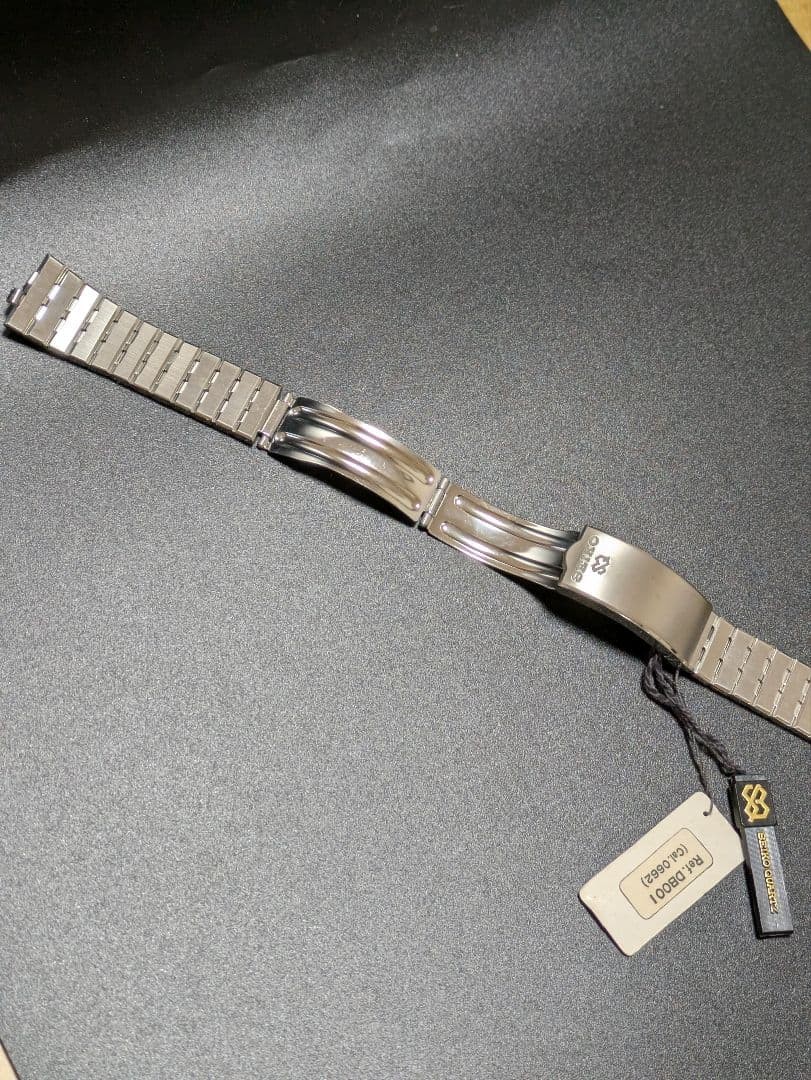 SEIKO stainless steel simple metal band with tag.