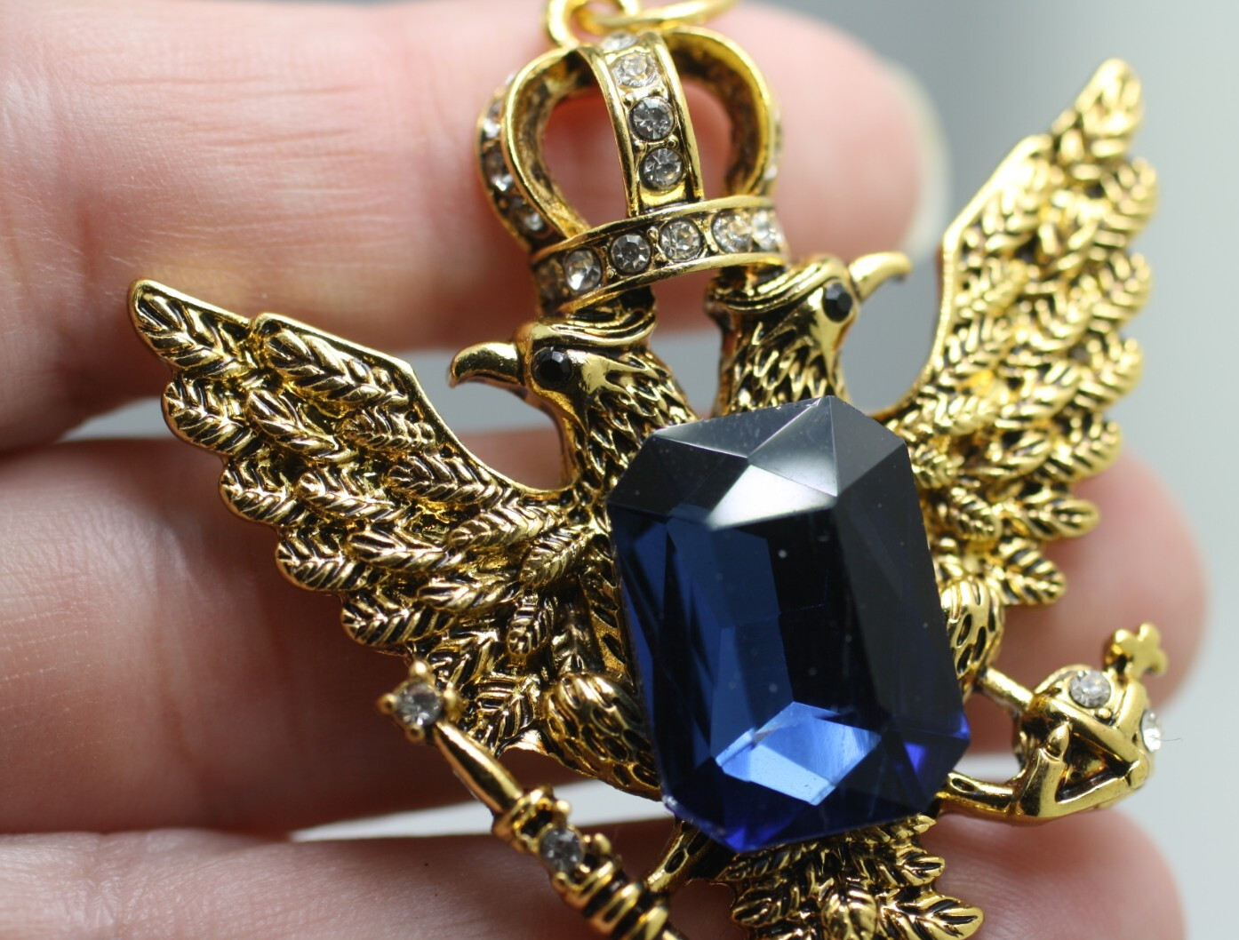 Gold tone double eagle crown blue emerald cut stone pendant regal style