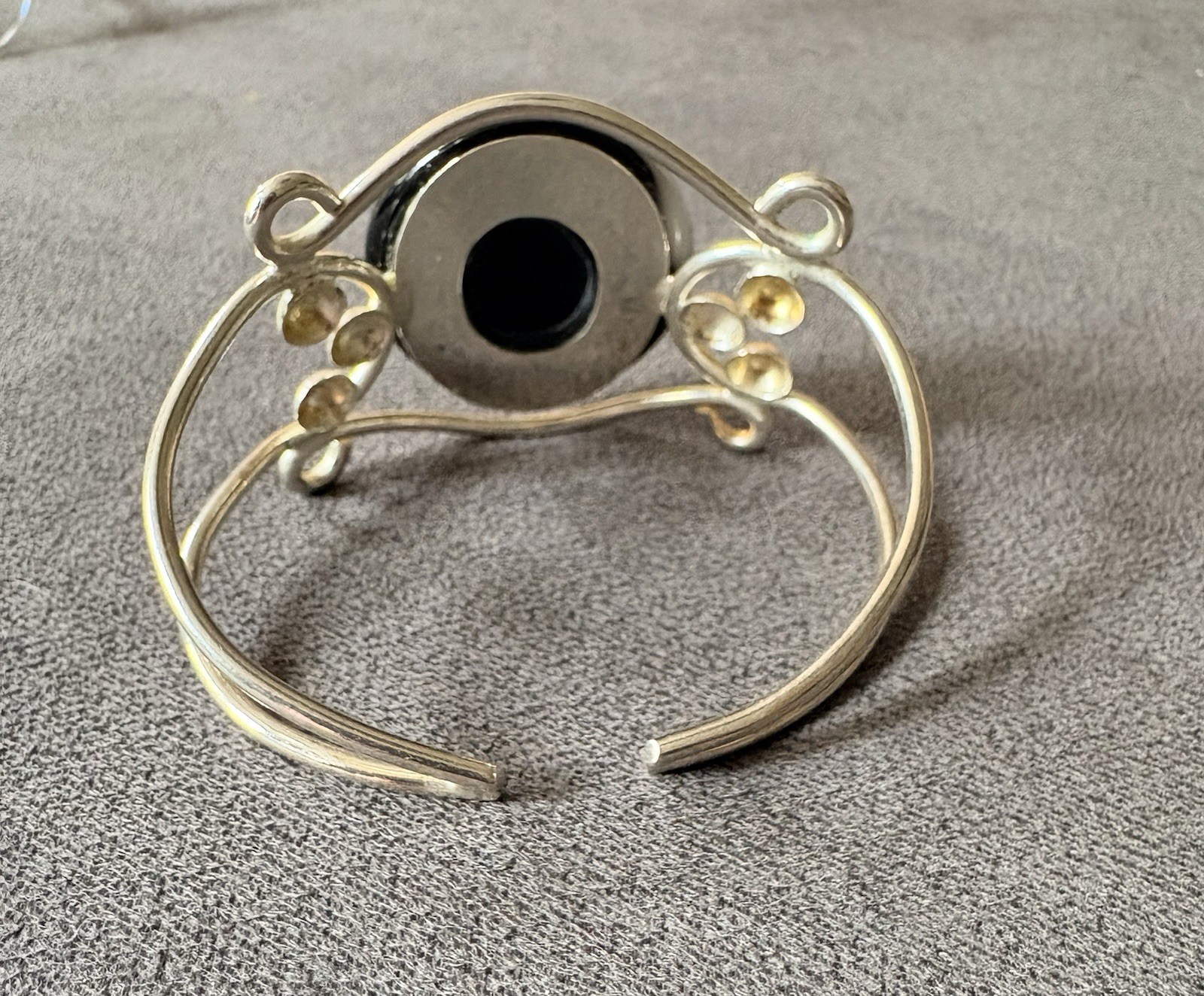 Silver wire cuff bracelet with circular dichroic glass black/gray cabochon