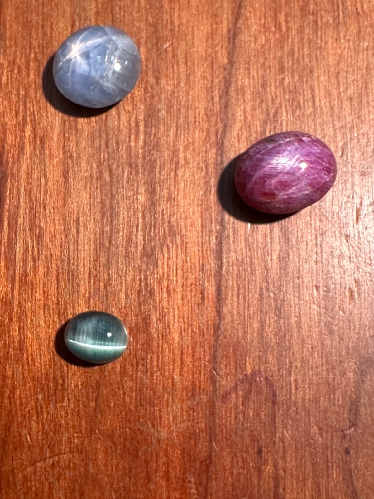 STAR SAPPHIRE CABOCHON 5.25CT, STAR RUBY SAPPHIRE 6.71CT, CAT’S EYE TOURMALINE 1