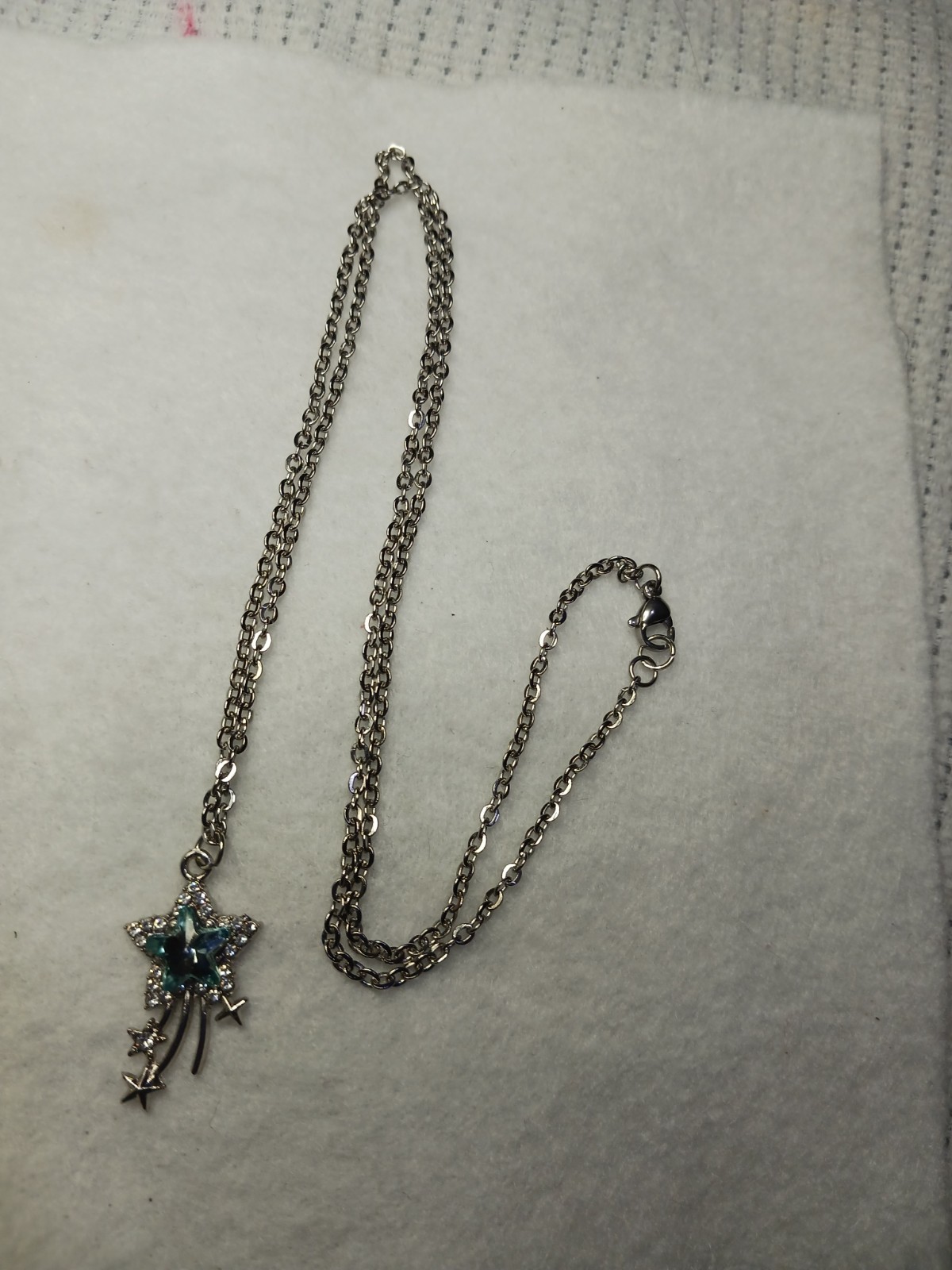 This Unique Blue Shooting Star Charm Is 1″, On A 24″ Silvertone Chain.