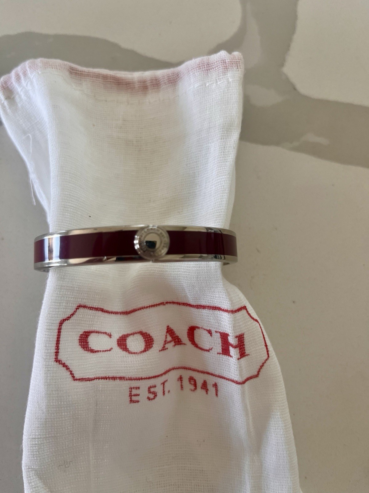 COACH Burgundy Enamel with Silver Accent and Hinged Closure Bangle Bracelet