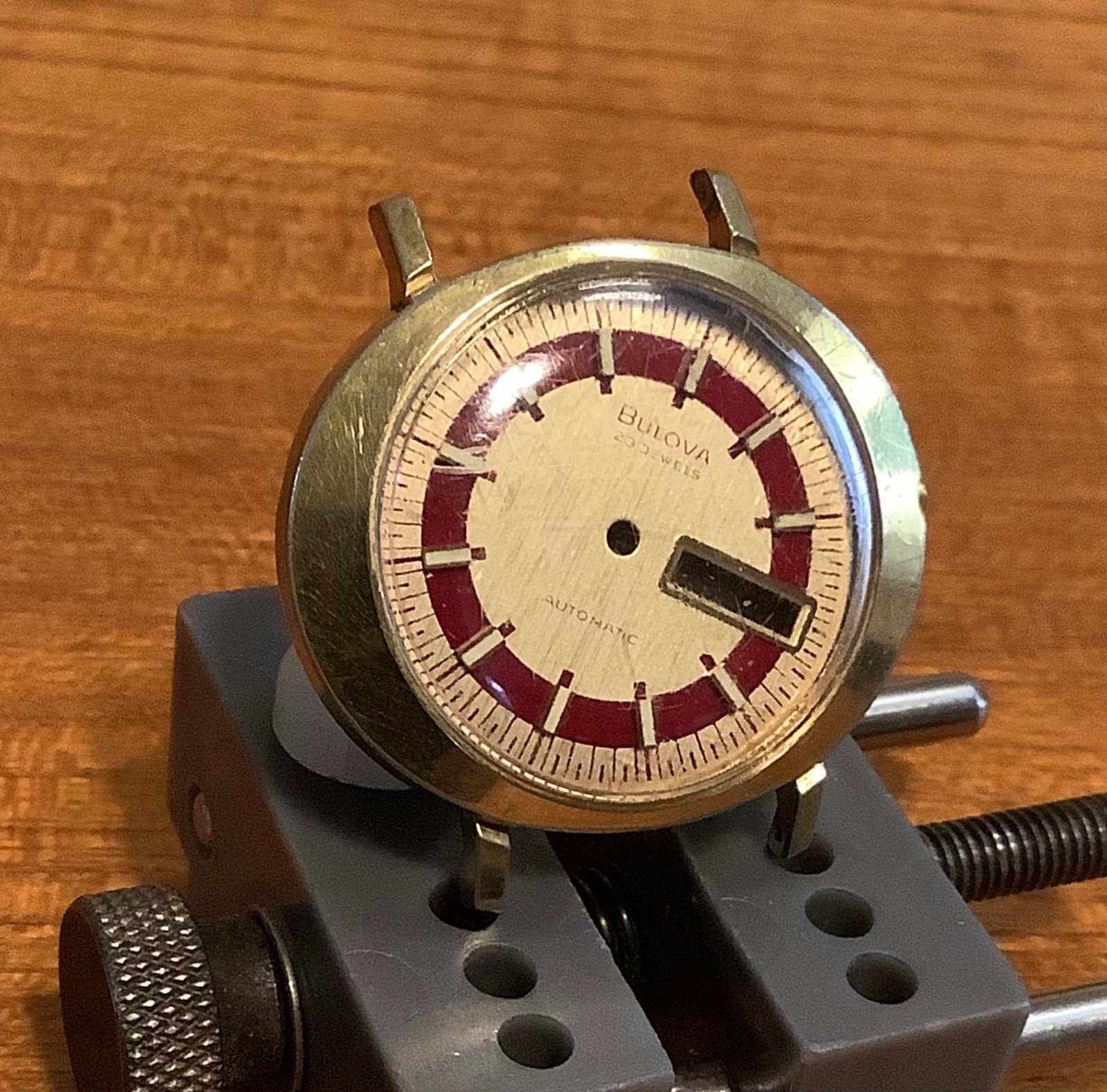 Bulova Part 11AOACB UFO Man’s 10k Rolled Gold Watch Maroon Radial Ring Gold Dial