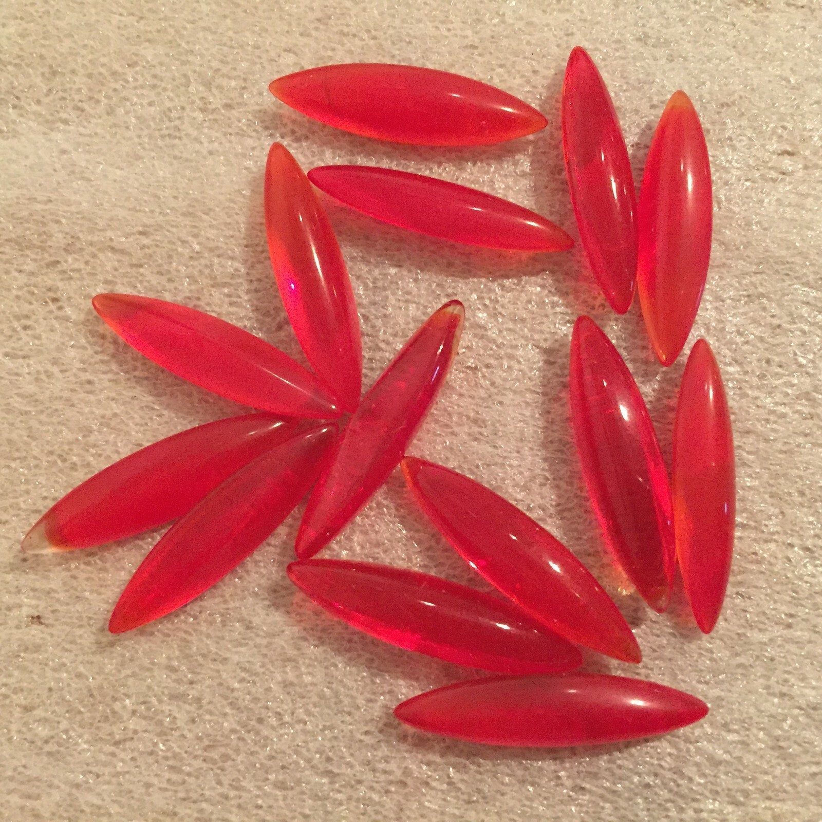 C115 24x6mm siam glass navettes, unfoiled faceted pointed back (40)