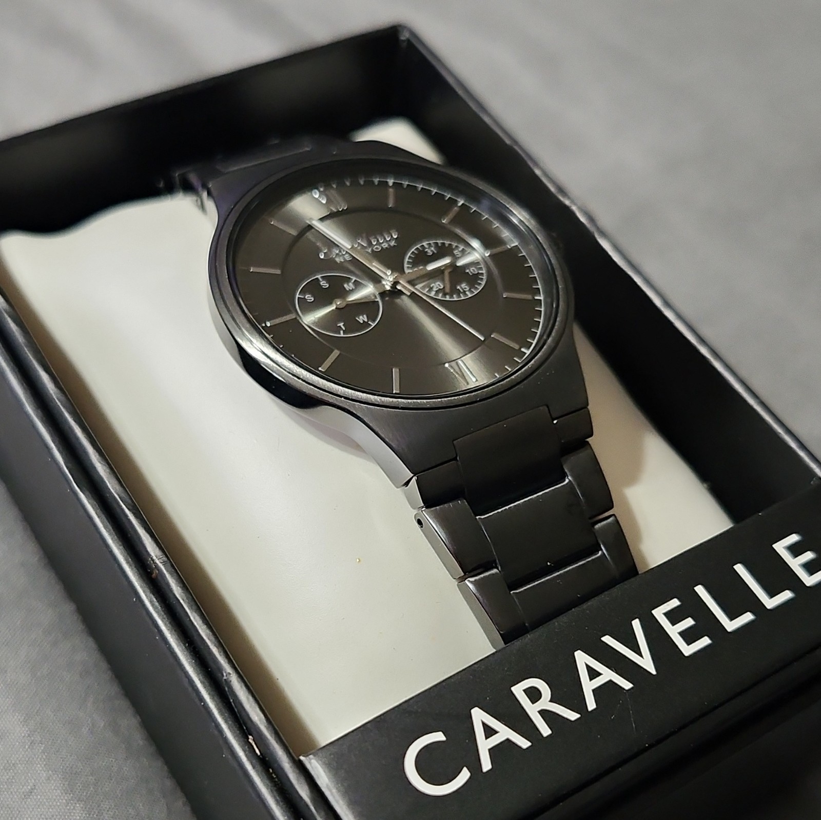 Caravelle New York Men’s Quartz Day/Date 43mm Black SS Watch Gray Dial Box