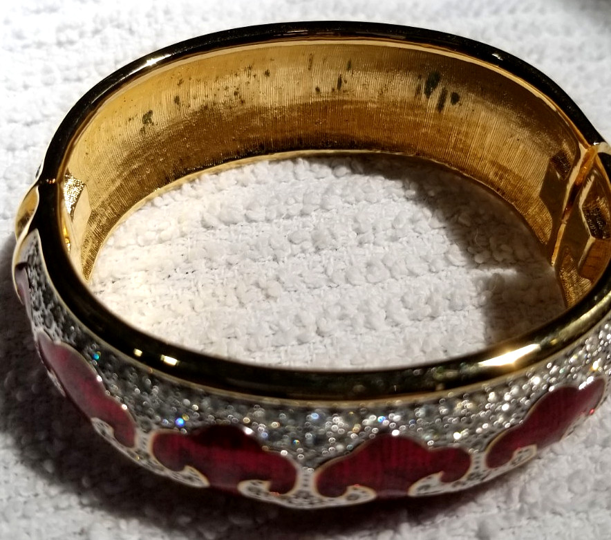 Bejeweled cuff bracelet with Red enamel and Gold tone metal Mint condition