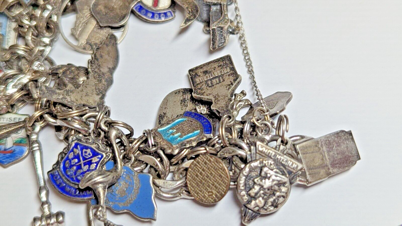 VINTAGE STERLING SILVER CHARM BRACELET WITH ABOUT 35 CHARMS WEIGHS 94.4 GRAMS