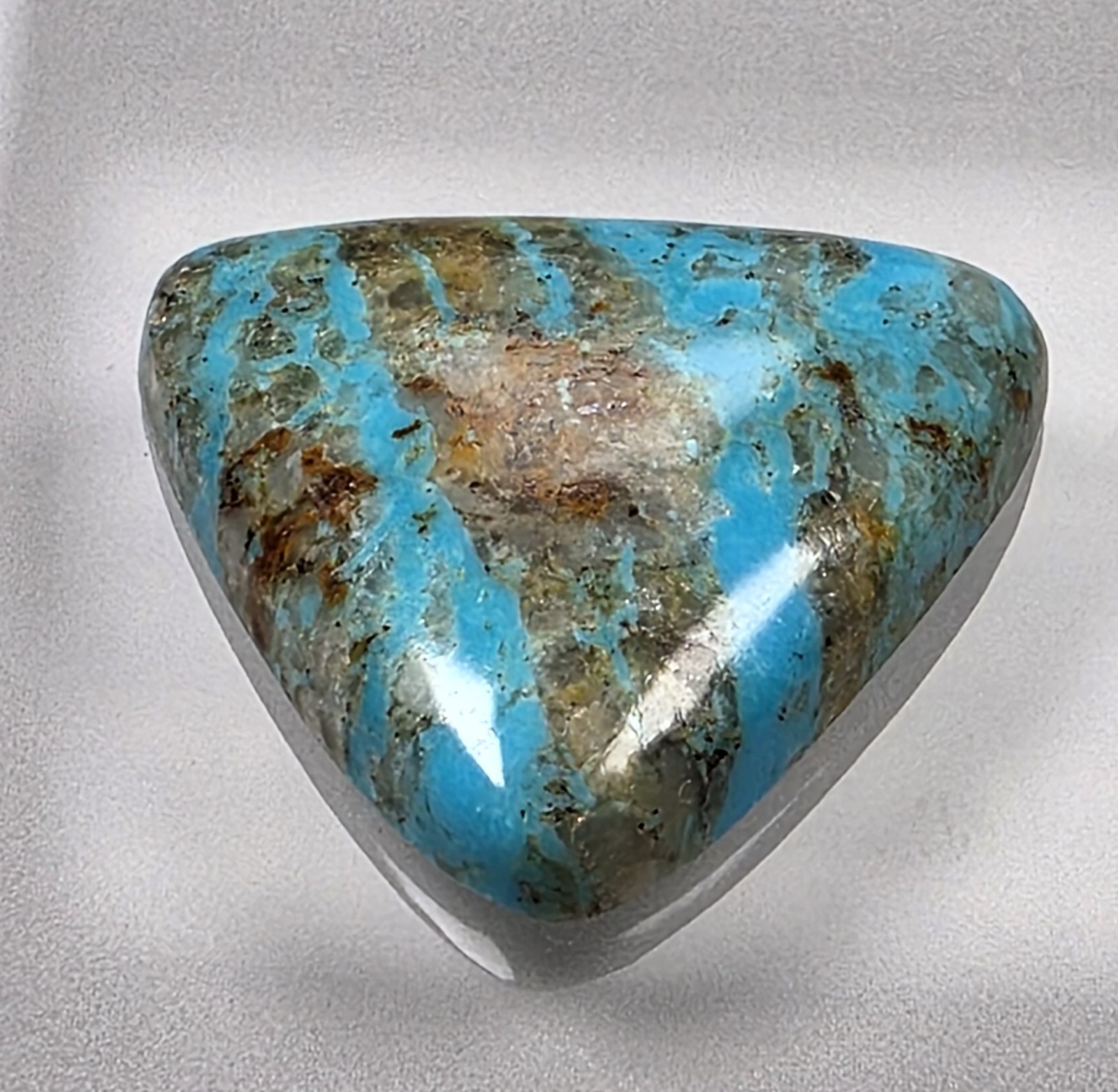 Kingman turquoise cabochon, boulder pattern, trillion cut, 30.49 carats, #B23