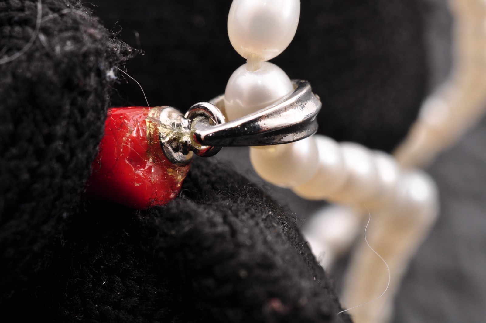 Sterling silver clasp, red coral and pearl pendant (total 54.0ct) Certification.