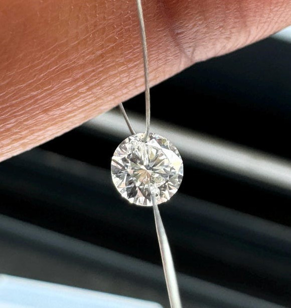 0.60tcw 6pcs EF Color Drilled Round Cut Lab Grown Diamond for Jewelry Creation.