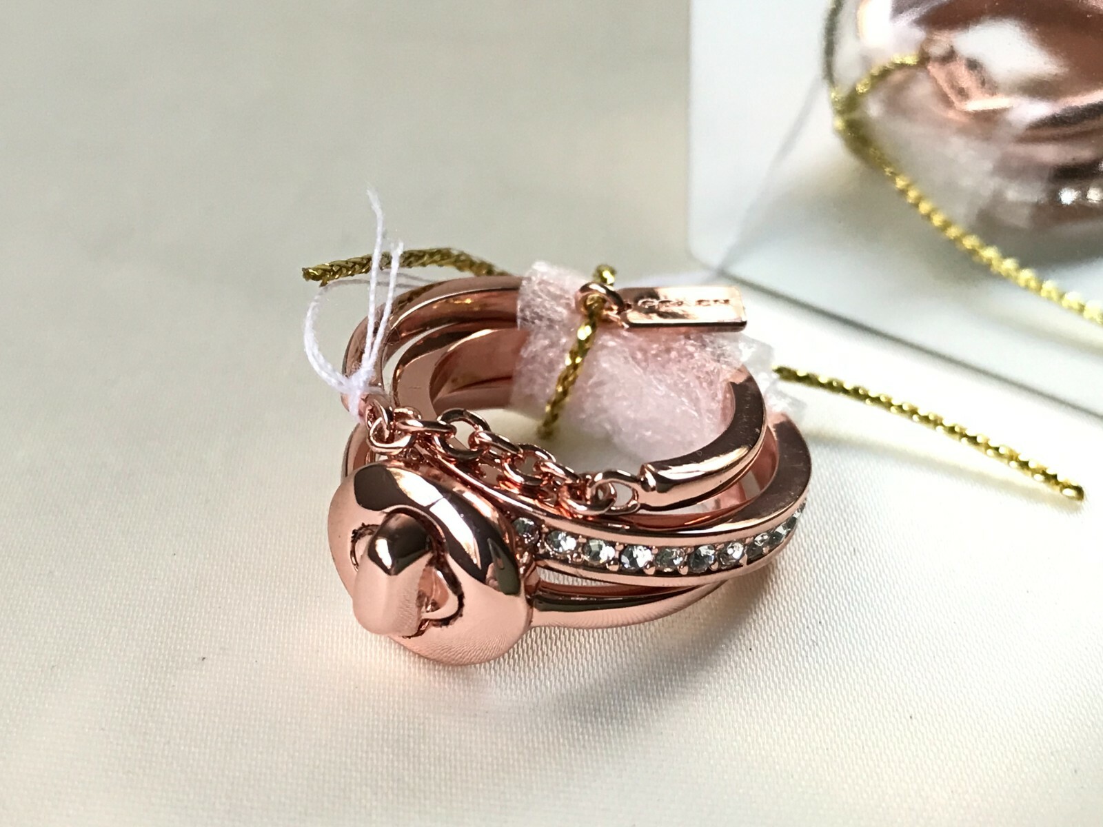 Coach pave turn-lock ring set