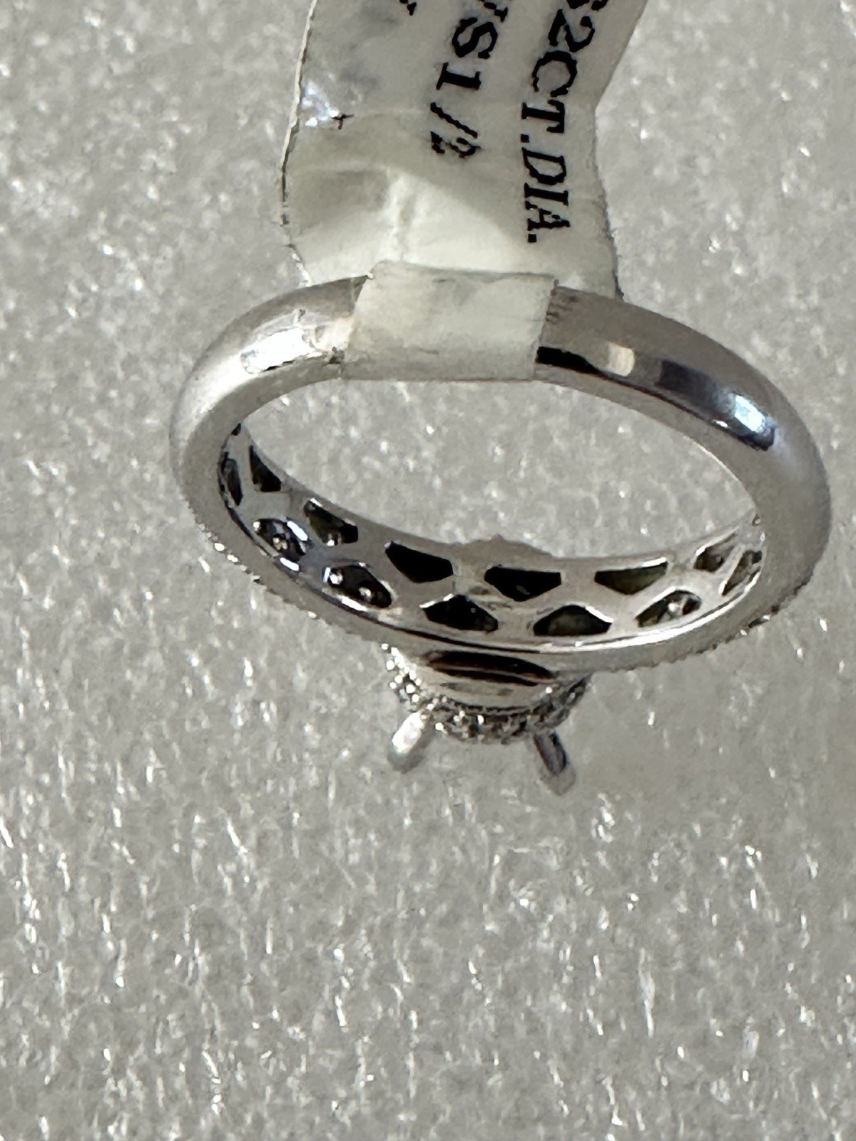 14kt,white gold semi mount ring with 0.62ct, VS2 clarity size 6, 4.40 grams.