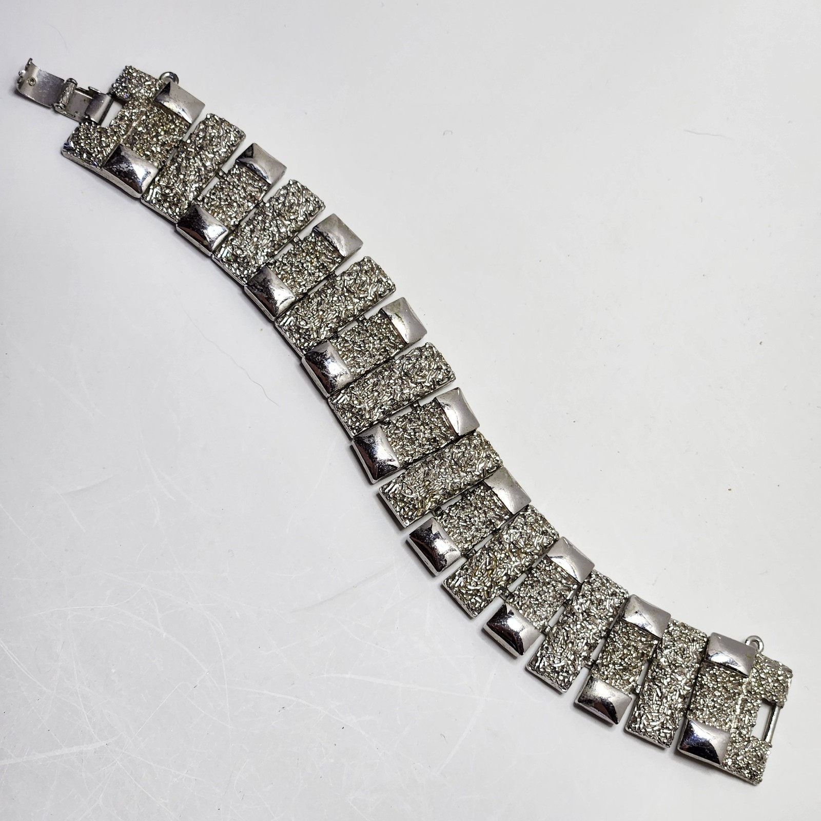 Vintage Monet Silvertone Bracelet Textured 1″ wide 7″ Fold Over Clasp No Safety