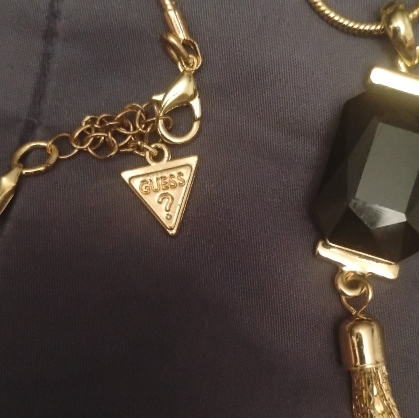 GUESS Gold Tone Snake Chain Necklace, Black Glass Rectangle Tassel Pendant
