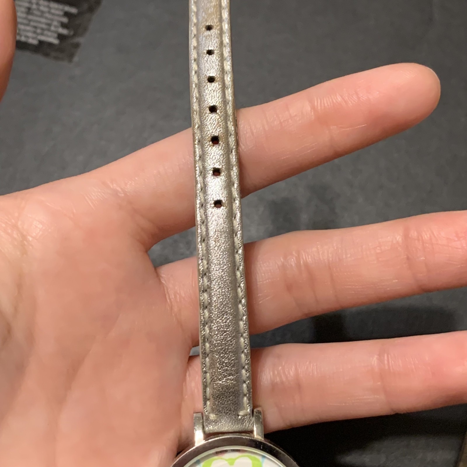 Coach Pastel Signature C watch featuring a white dial with a multicolor logo