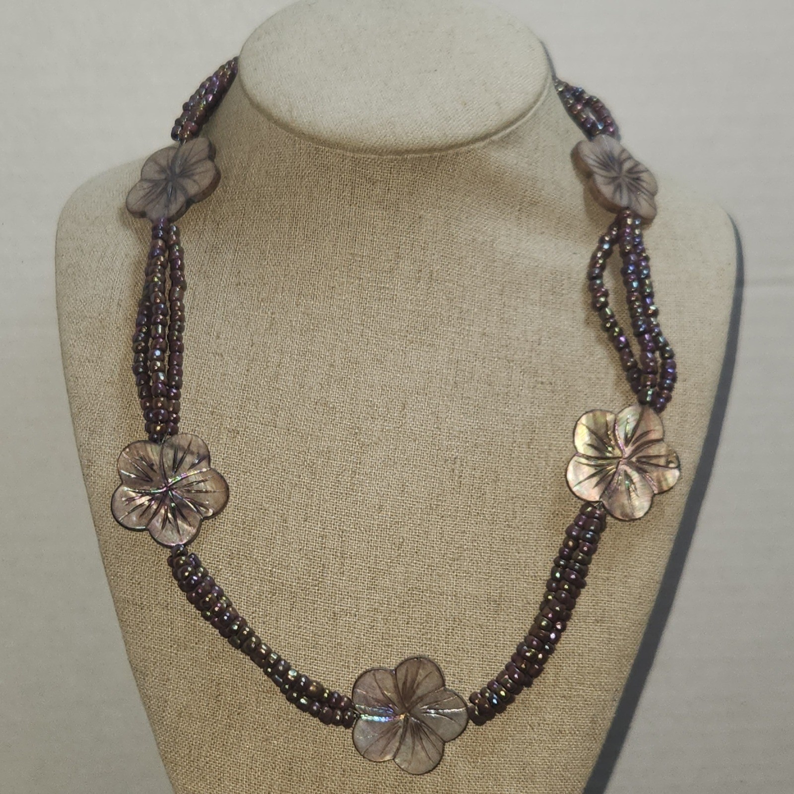 Iridescent Mauve Multi Strand Seed Bead Necklace Carved Shell Flower Toggle 21in