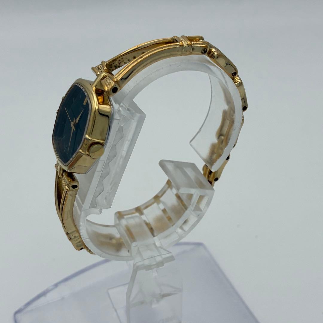Working SEIKO wristwatch, gold and black, with new battery (A72)