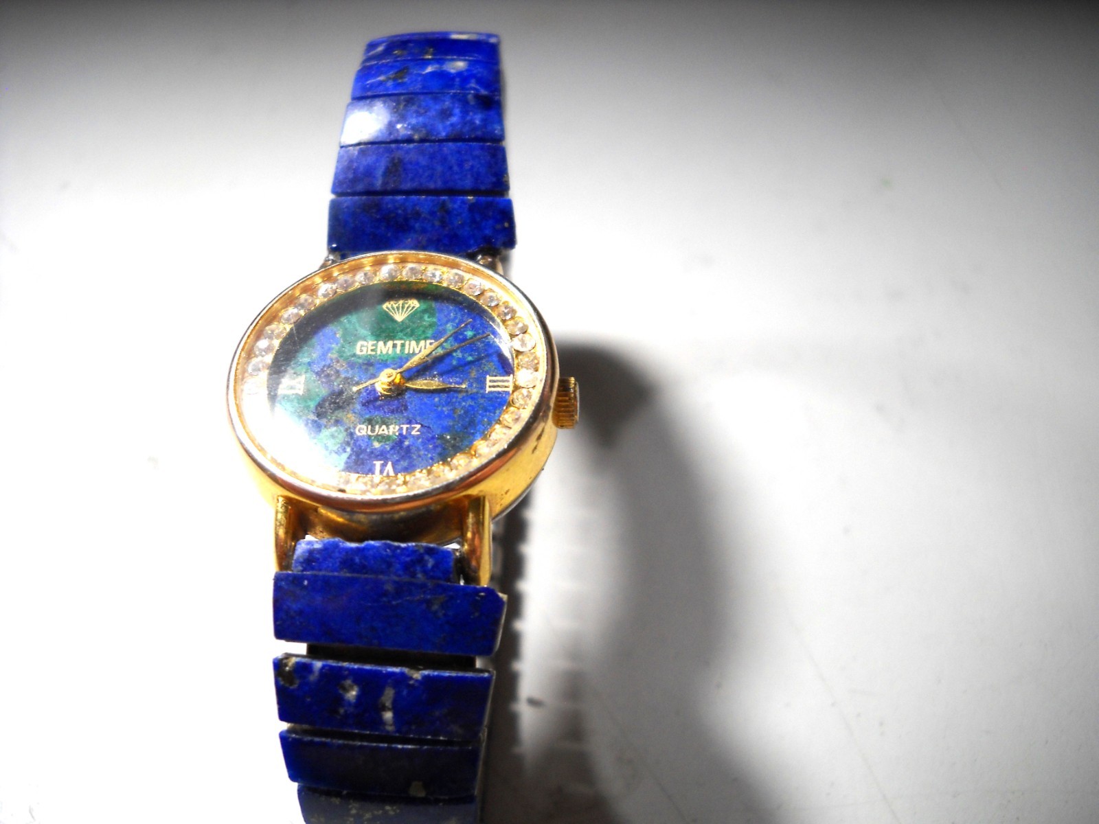 447L Gem Time Lapiz Lazuli set in 22mm gold tone case rinestone bazel 11mm band