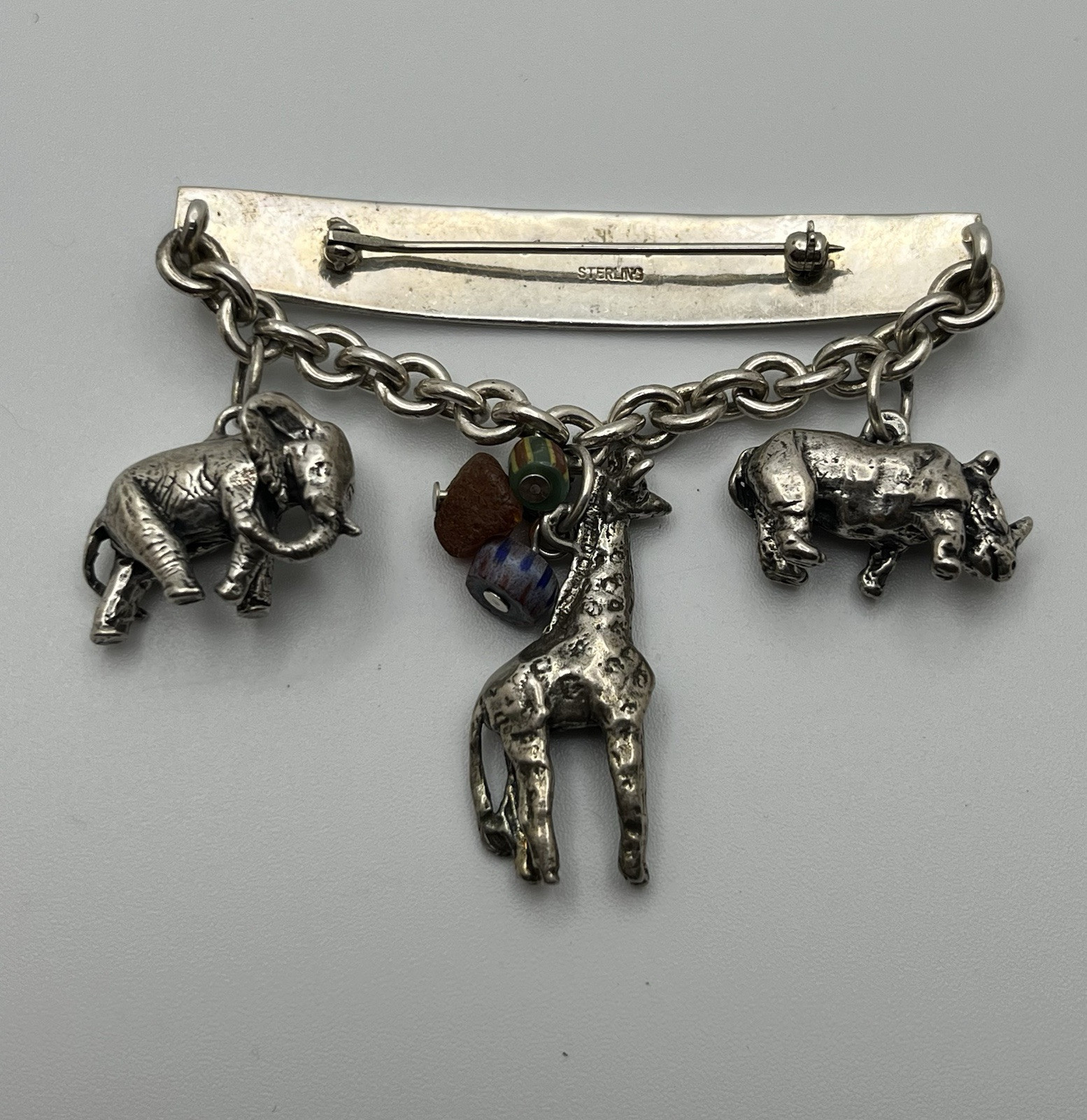 Vintage SUSAN CUMMINGs Safari Theme Sterling Silver Brooch/ Pin with charms!