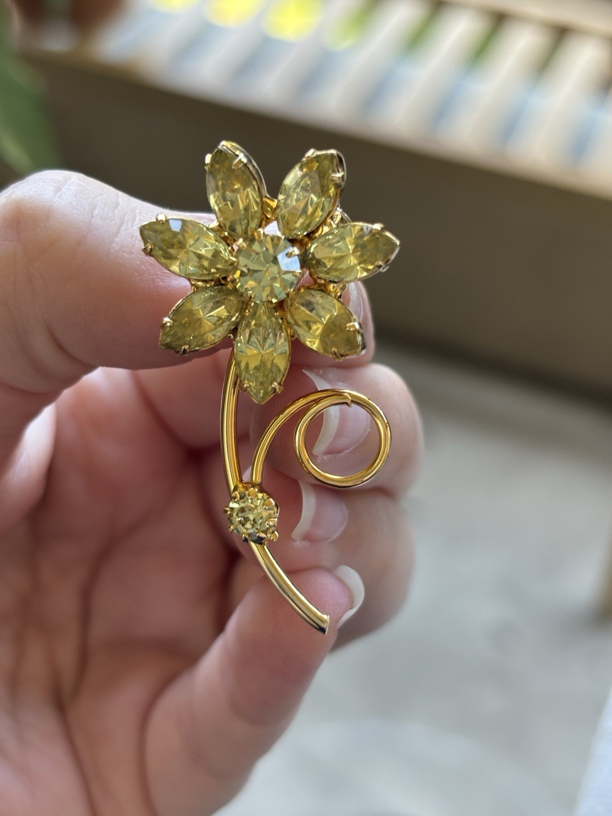 Lot of 3 gold tone floral brooches one signed