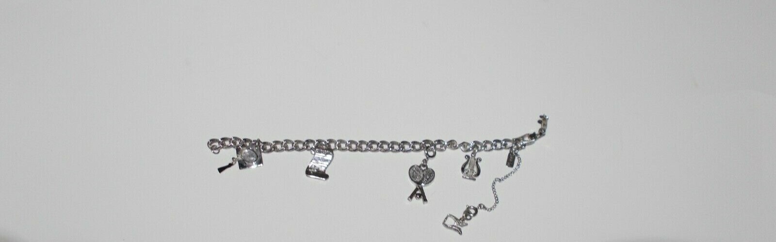VTG MONET Bracelet with 4 Charms Size 7in Silver Ton Safety Chain 