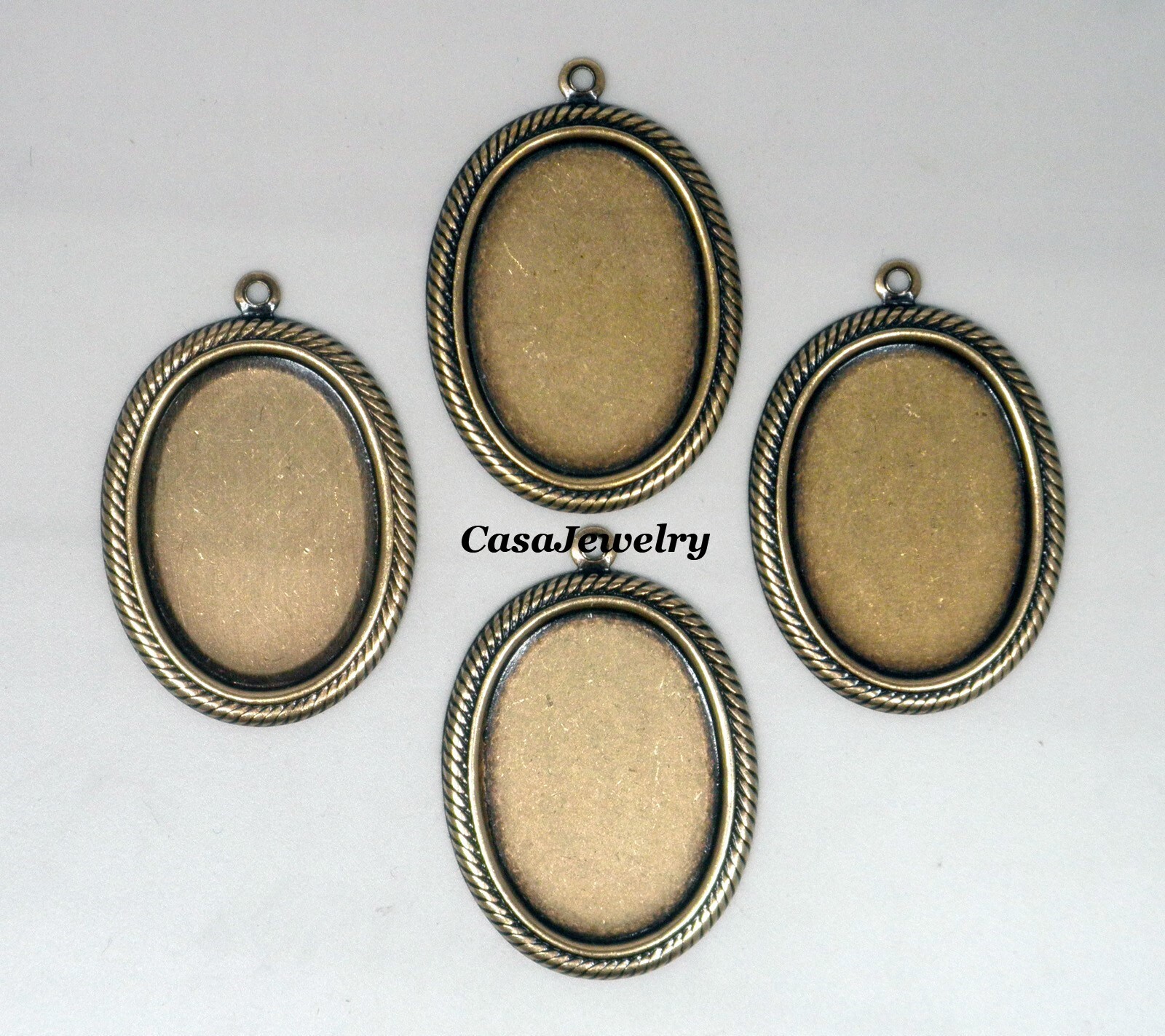 #1412 ANTIQUED GOLD ART DECO 25×18 BEZEL W/TOP HANG RING – 4 Pc Lot