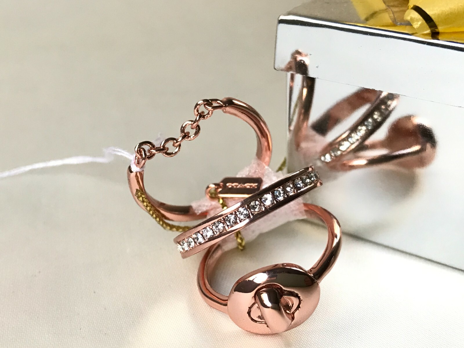 Coach pave turn-lock ring set