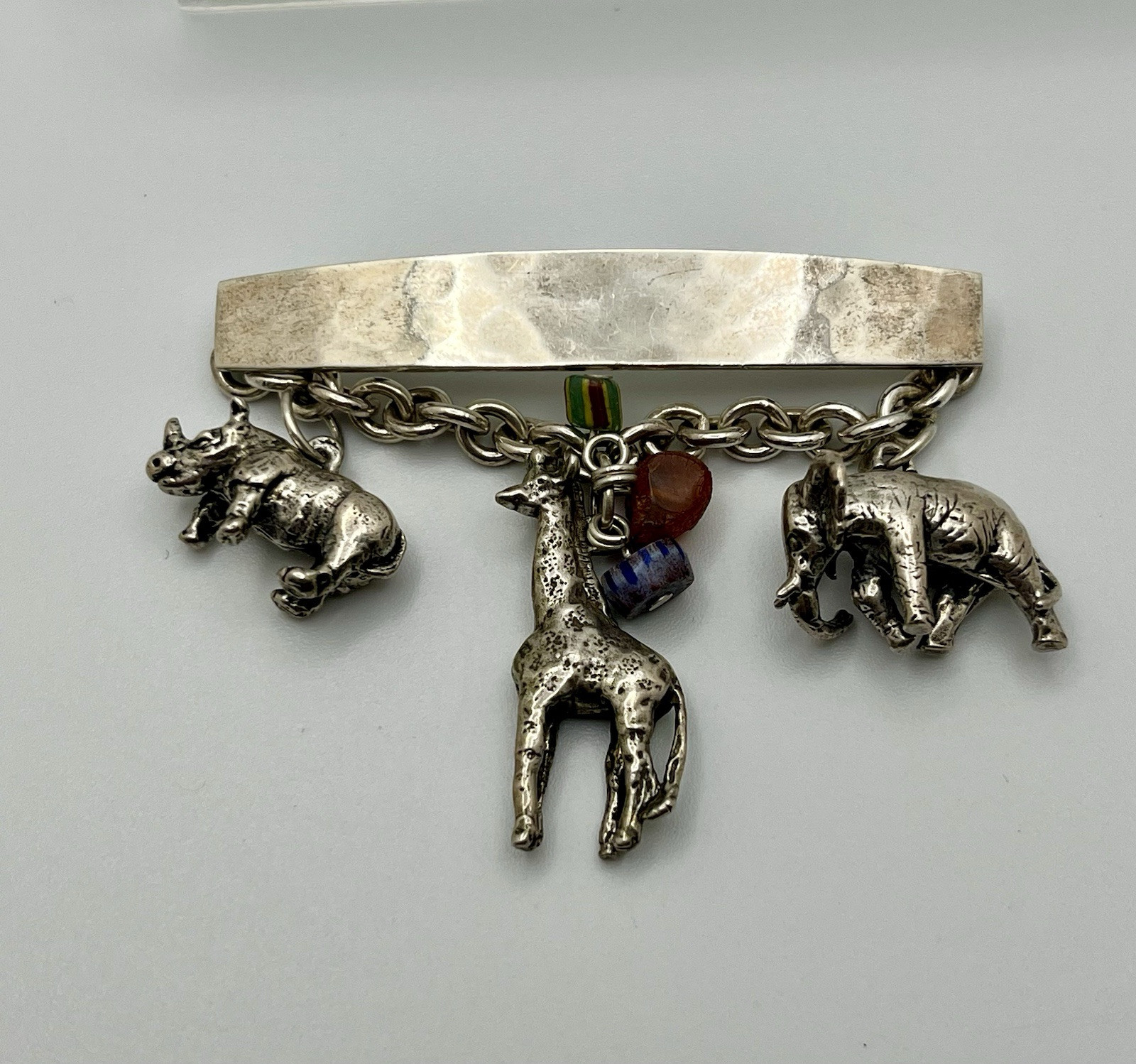 Vintage SUSAN CUMMINGs Safari Theme Sterling Silver Brooch/ Pin with charms!
