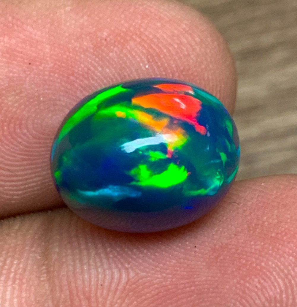 Ethiopian Opal Gemstone 6.35crt Black Oval Cabochon Rainbow Flash Welo Loose Gem