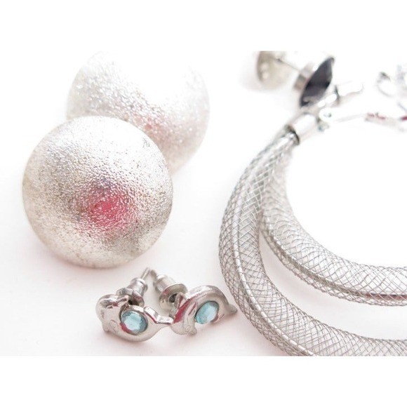 Silver plated and silver toned jewelry lot has 4 pairs