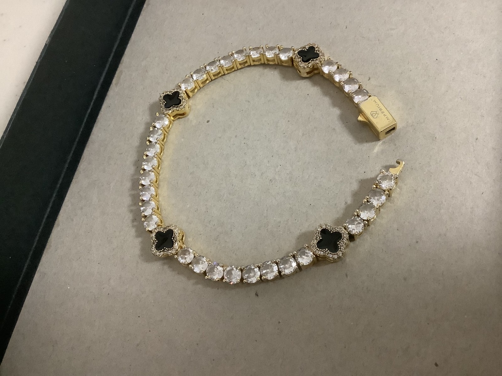 Imperium 18k gold plated CZs four leaf clover black enamel tennis bracelet 7″