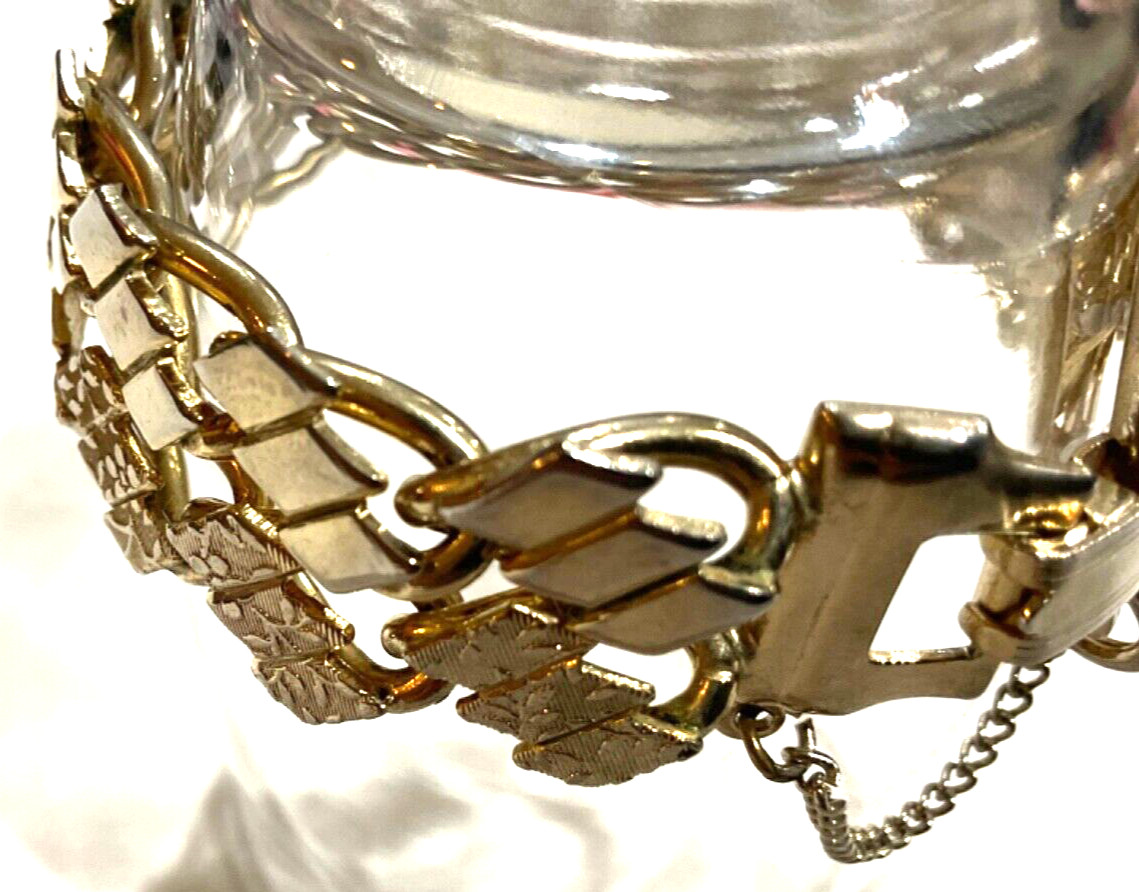 VTG ETCHED FLORAL DESIGN GOLD TONE BRACELET WITH SAFETY CHAIN FOLD OVER CLASP