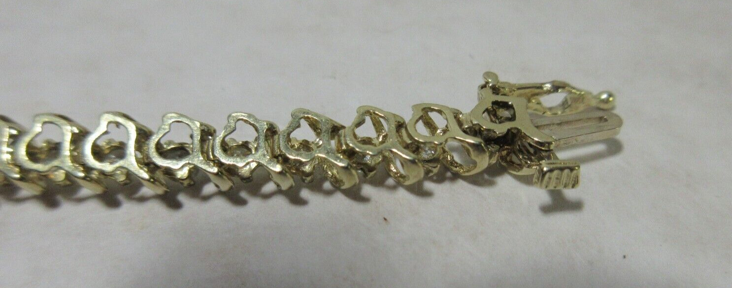 14K Yellow Gold tennis Bracelet, Wt 12.5g, locking 42 x 2.5mm diamonds si2 I1