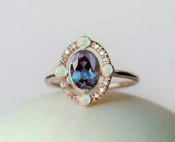 2.50Ct Oval Cut Lab-Created Opal Bezel Set Engagement Ring 14K Rose Gold Over