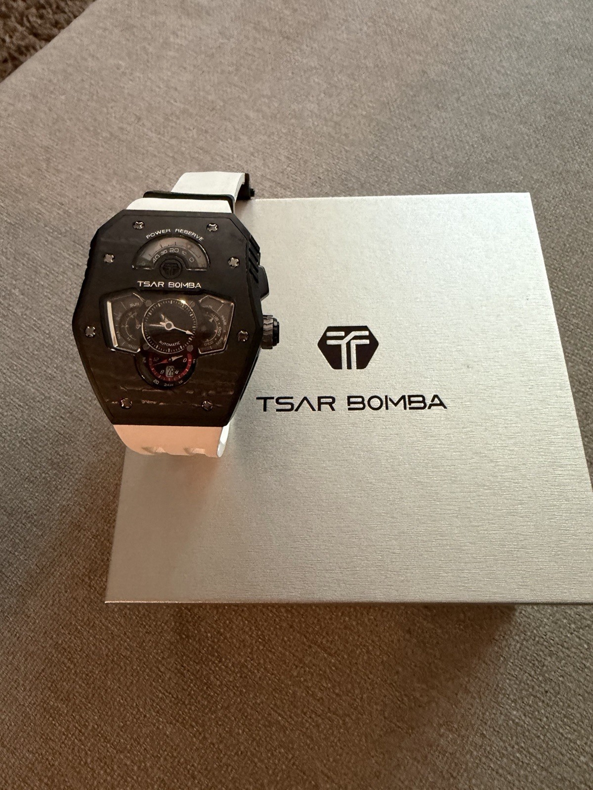 TSAR BOMBA Men’s Automatic Power Reserve Black Carbon Tonneau White Strap Box