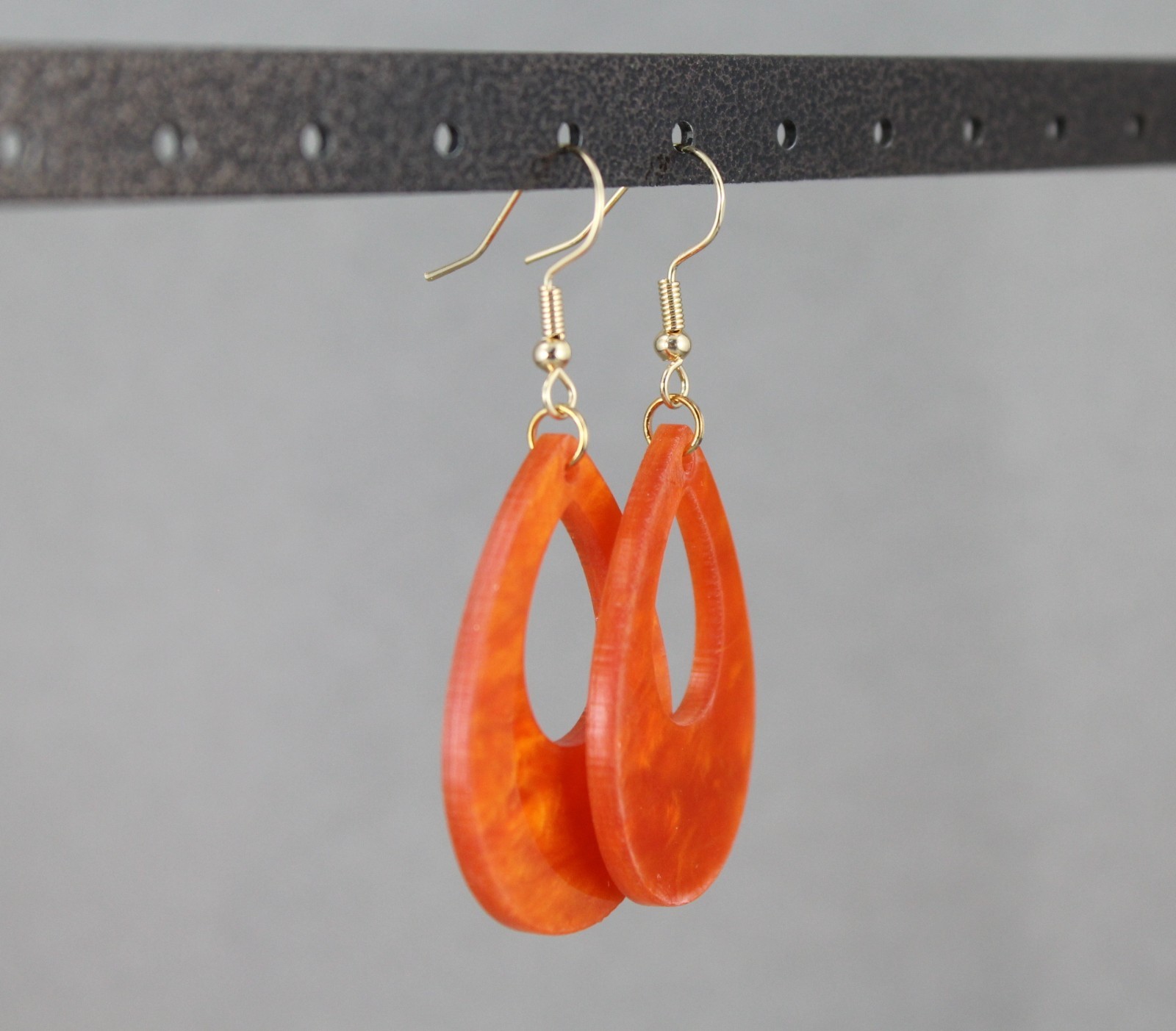 Orange teardrop earrings lightweight dangle cut out oval outline 2.25″ long
