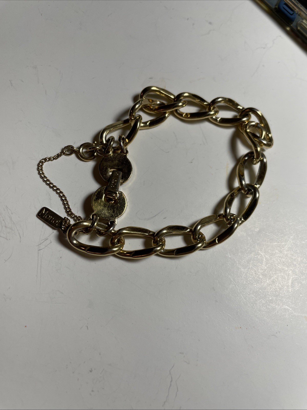 Monet GOLD tone link bracelet with safety chain