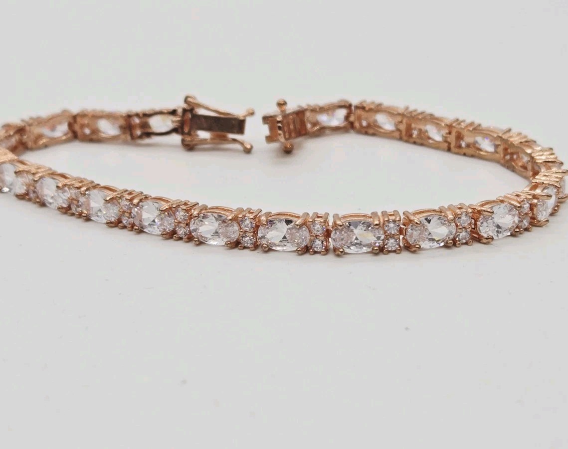Tennis Bracelet White Oval Crystal rhinestone signed 925 Rose Gold tone 7.25 in