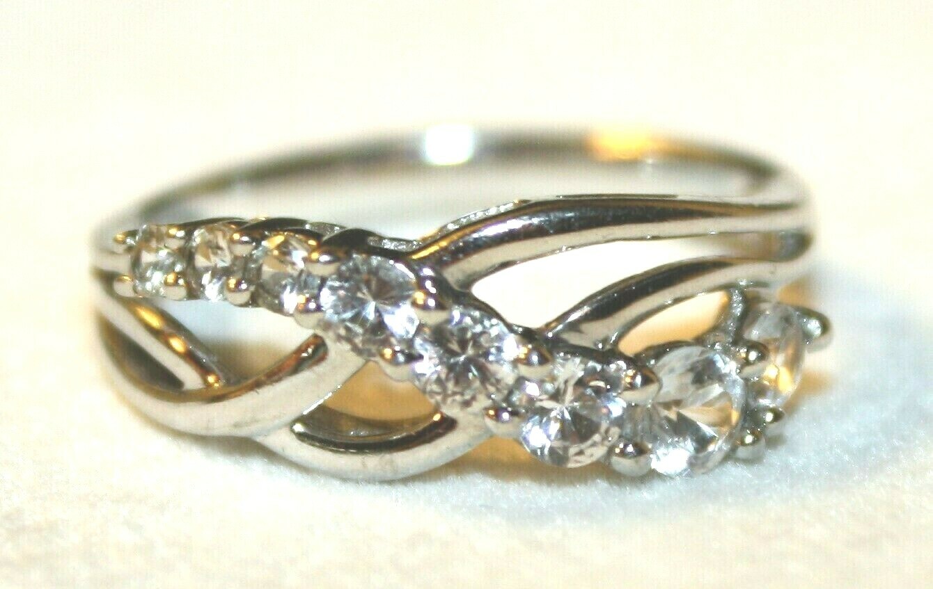 925 POLISHED STERLING SILVER ROUND-CUT PRONG SET NATURAL WHITE TOPAZ WAVE RING