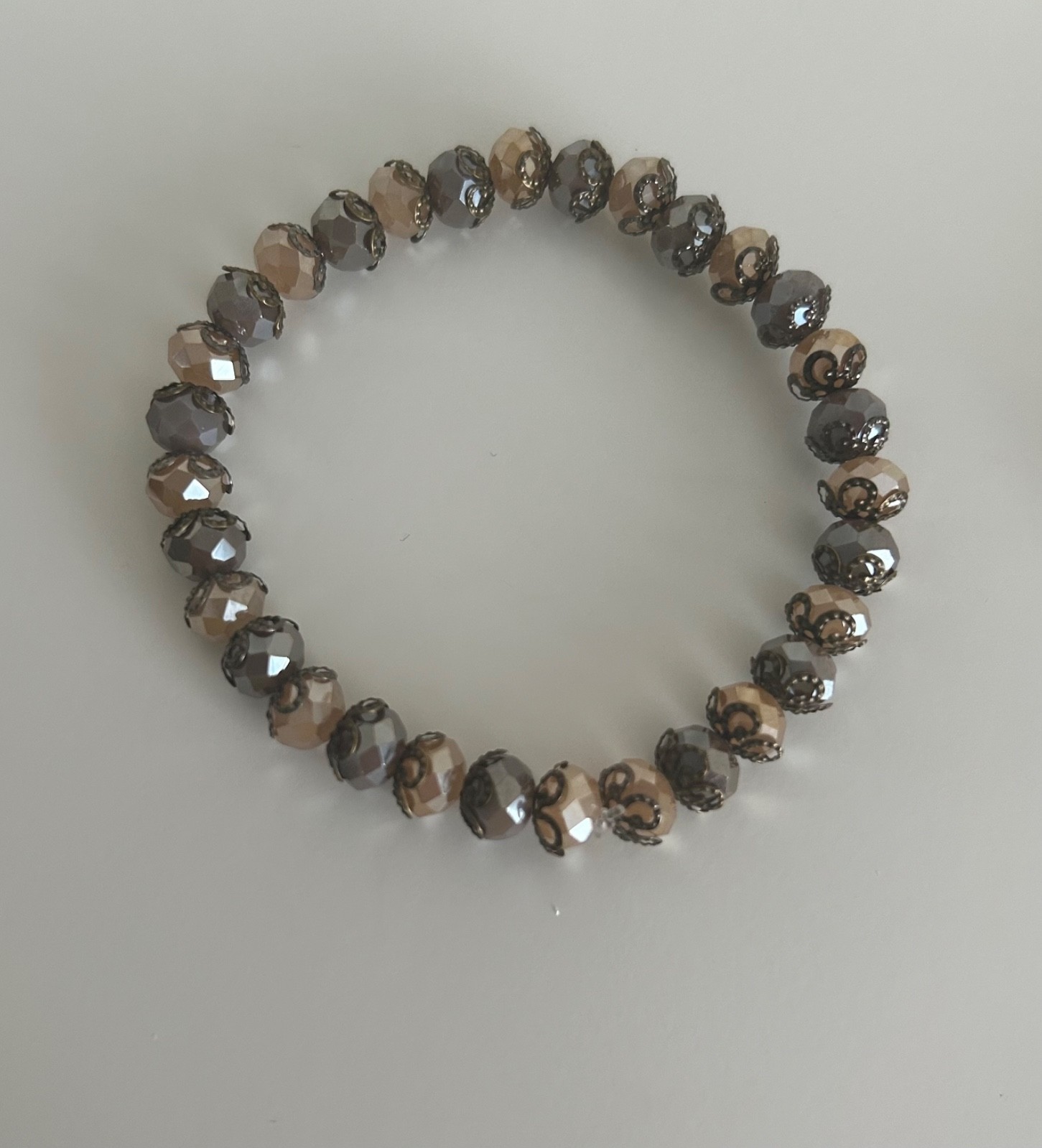 Ladies beautiful bracelet, with beige Austrian Crystal beads and copper detail