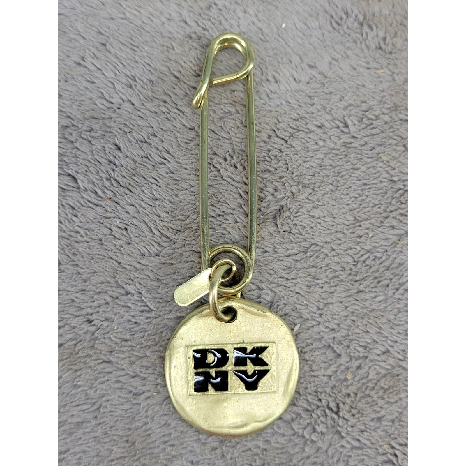 Vintage 1993 DKNY Gold Tone Safety Pin Brooch Round Logo Charm Pendant 3″