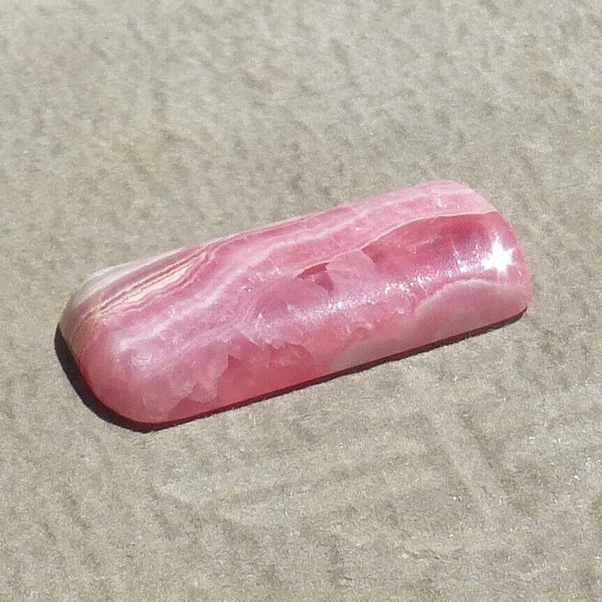 Pink w/calcite banding natural Rhodochrosite cabochon Argentina (27.60 carats)