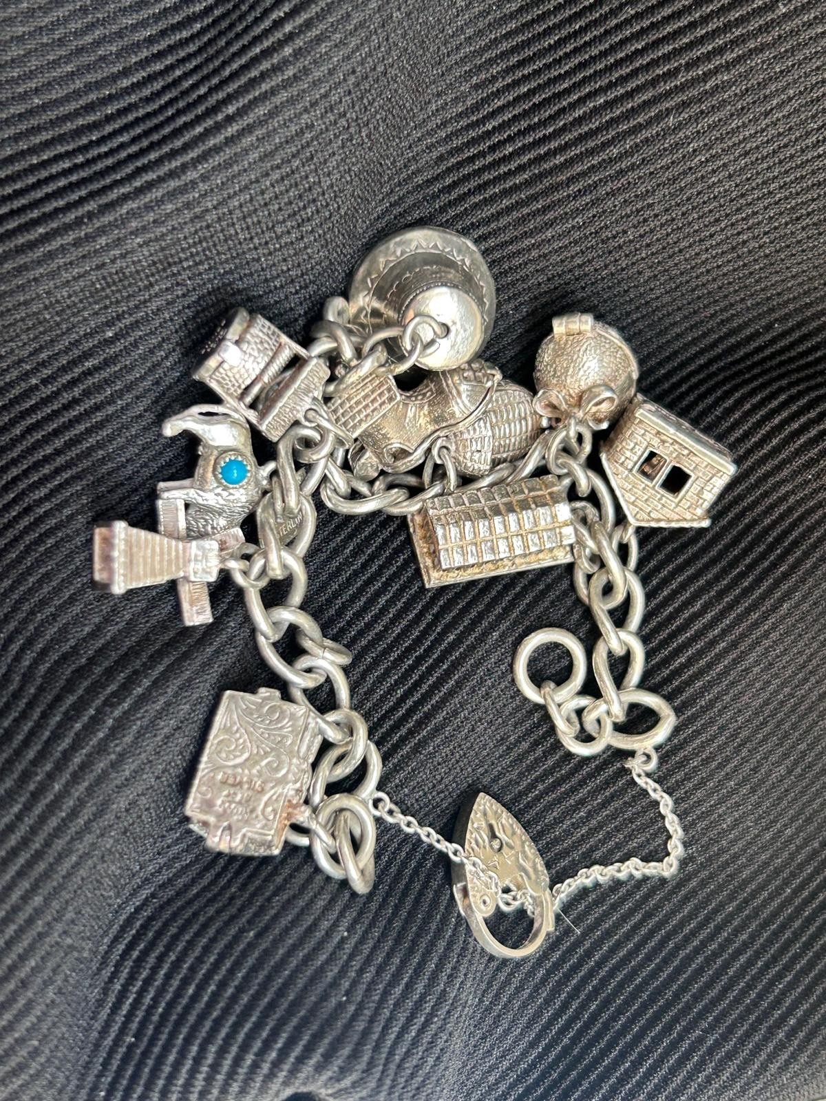 VINTAGE SOLID SILVER CHARM BRACELET WITH 10 CHARMS which open/move & entertain
