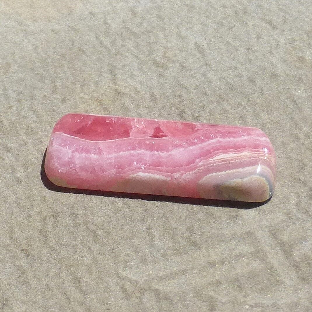 Pink w/calcite banding natural Rhodochrosite cabochon Argentina (27.60 carats)