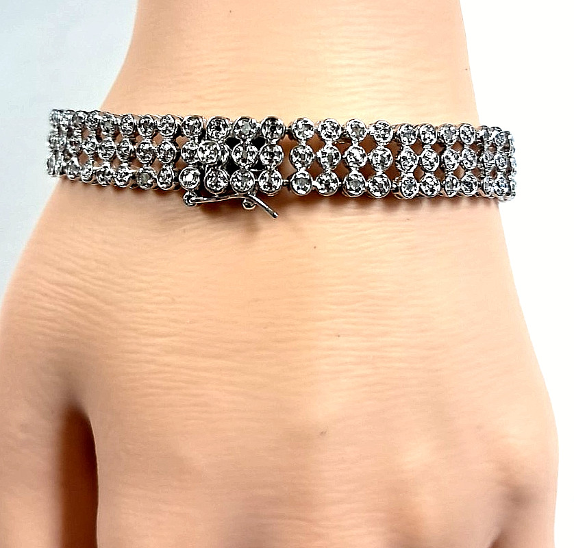 STERLING SILVER DIAMOND TENNIS BRACELET (approx. .25ct TDW) (7″ in) 14.76GR
