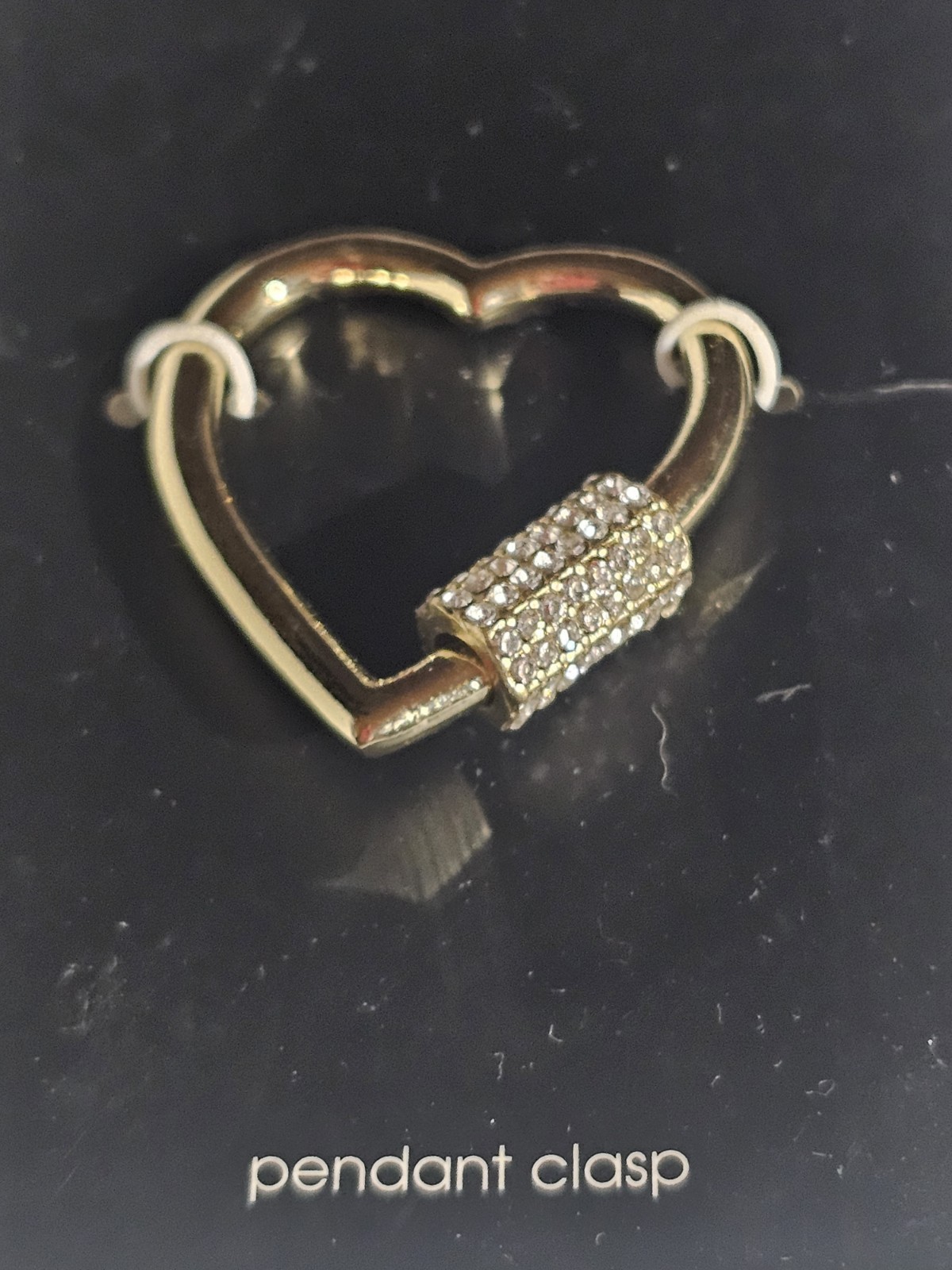 Hildie & Jo “Charmed Life” pendant clasp features a gold-tone heart shape with a