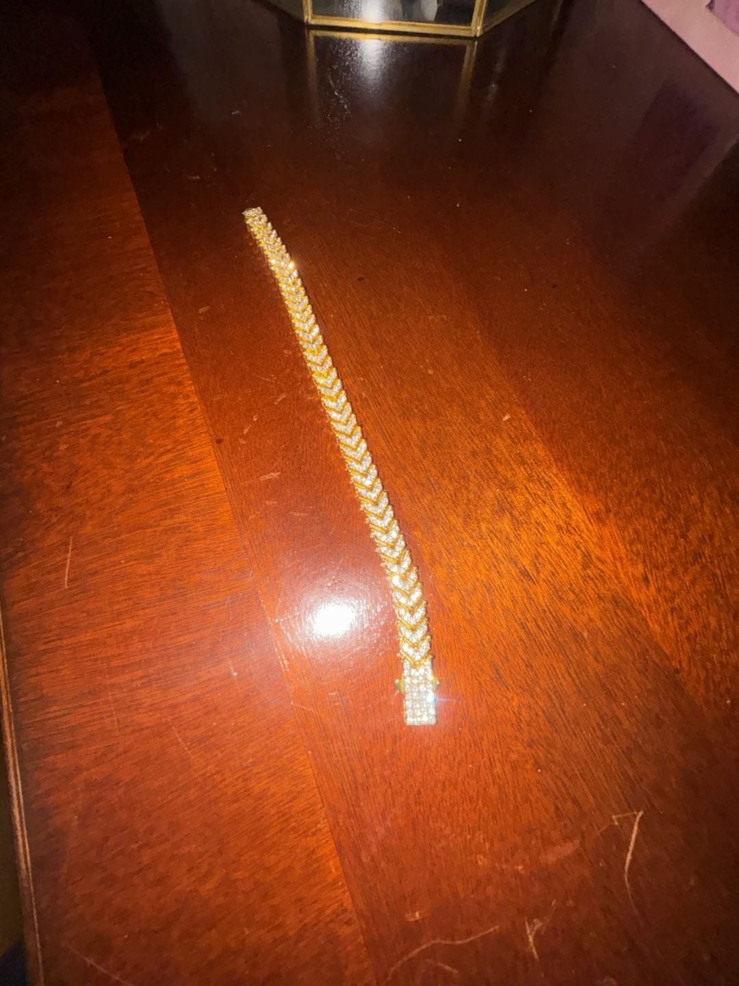 Iced Out Gold Tone Fish Tail Chevron Link Tennis Bracelet with Cubic Zirconia