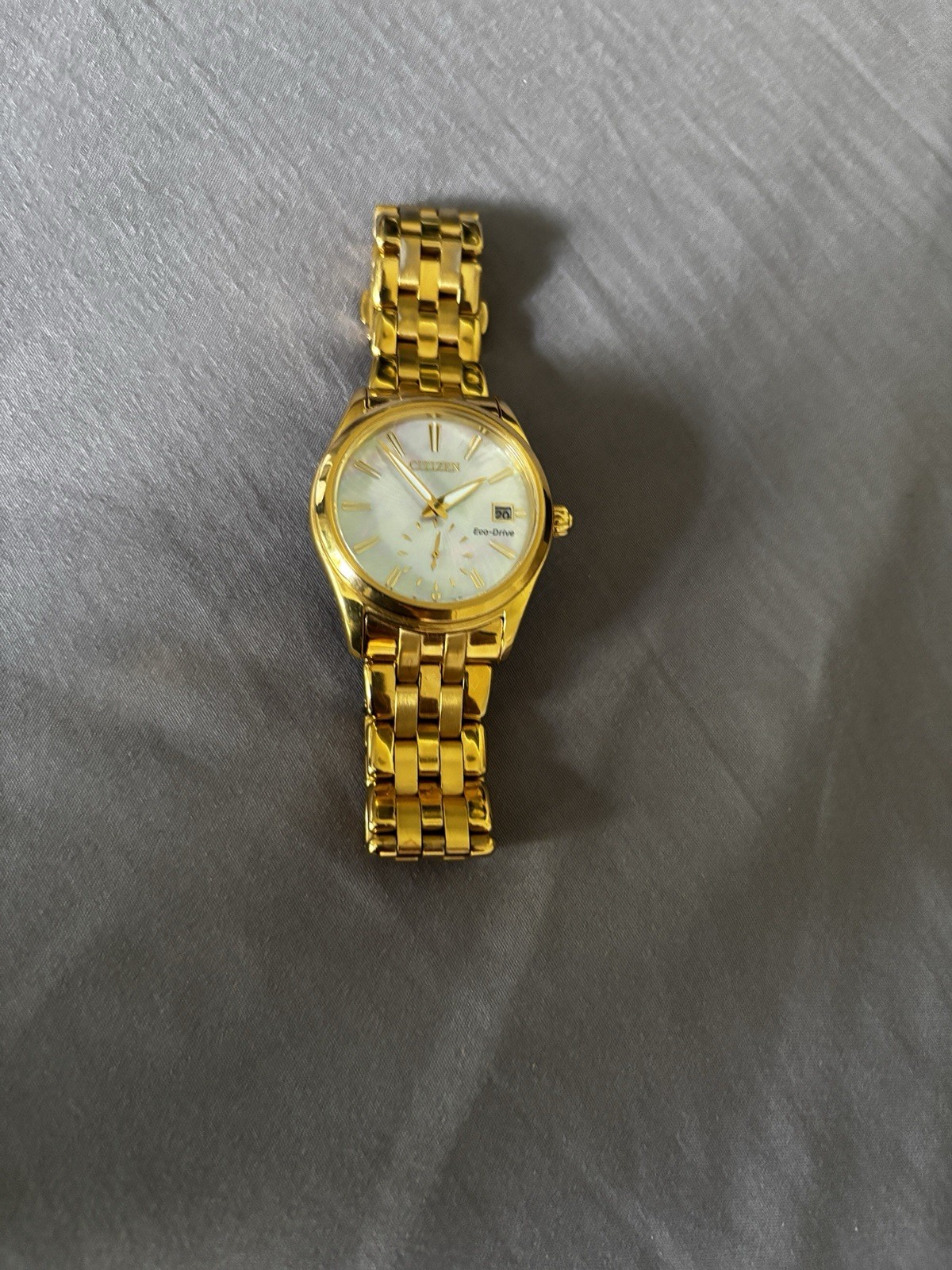 Citizen Eco-Drive Women’s Gold Tone Bracelet Watch White Dial Date Analog